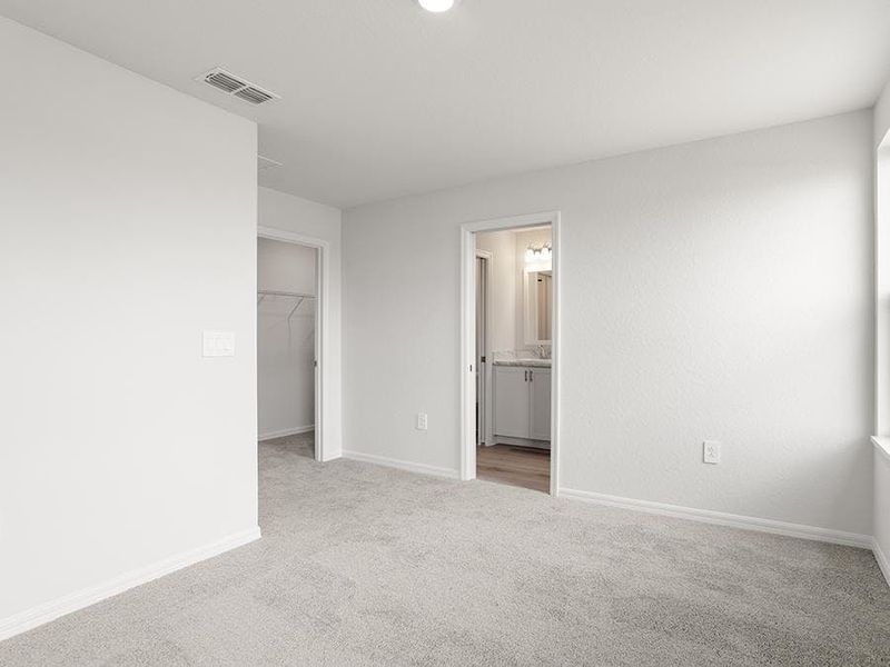 Upstairs, rest and relaxation await in your private owner`s suite - Aruba townhome by Highland Homes