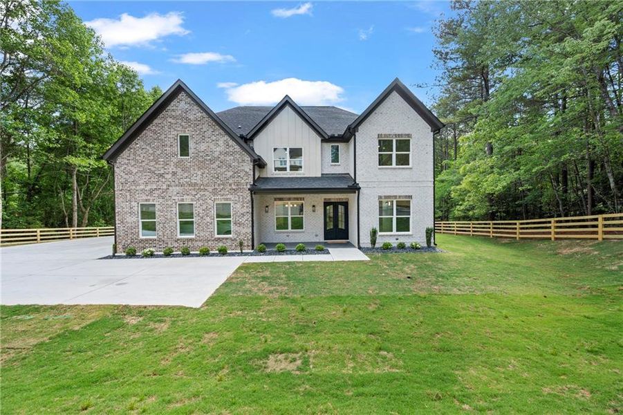 Front exterior of a new home in , Dacula, GA, highlighting curb appeal (Image 2). Front exterior of a new home in , Dacula, GA, highlighting curb appeal (Image 2).