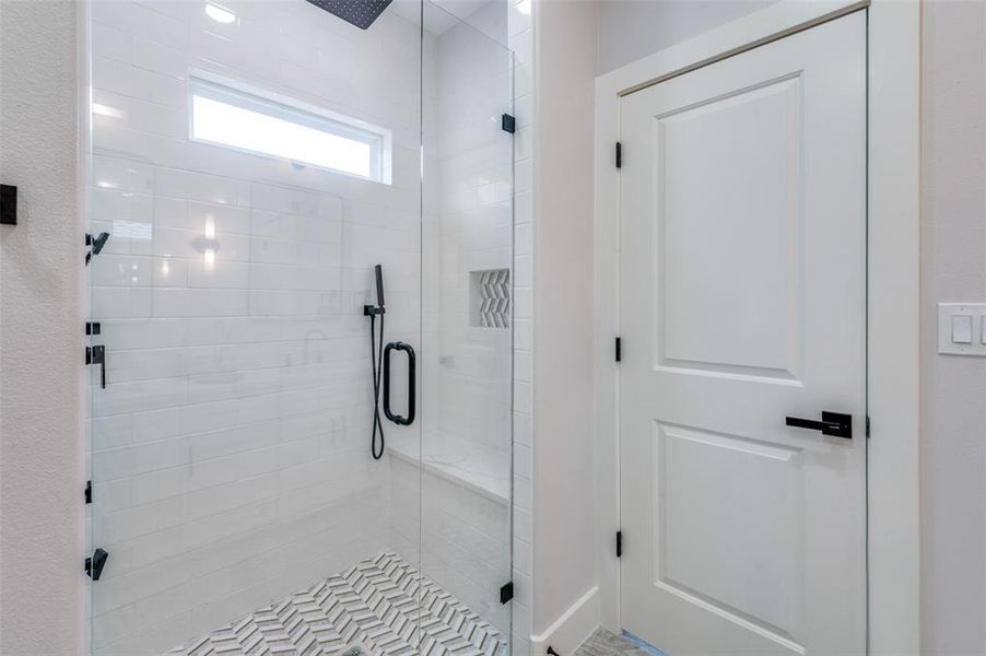 Bathroom with a shower with shower door