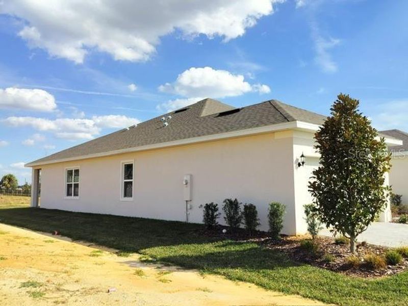 Exterior details and patio area of a home in Leela Reserve, Tavares (Image 3).