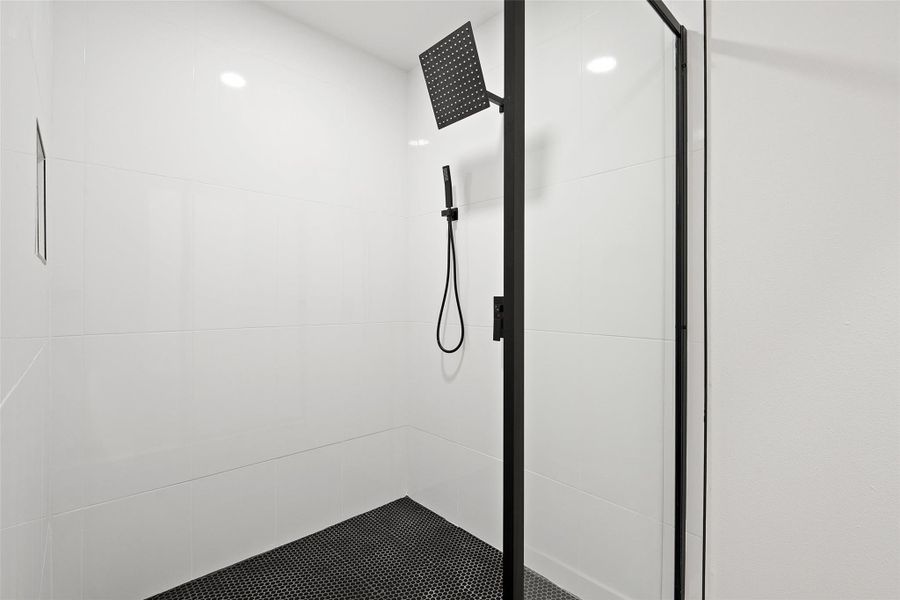 Full bath with a shower stall Full bath with a shower stall