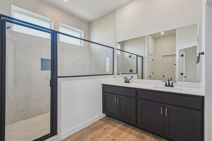 Representative furnished interior of a home built from the Rhyan by Chesmar Homes in Stream Waters, Seguin (Image 10).