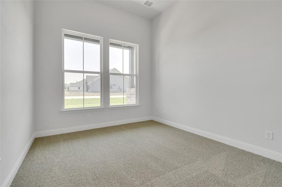 View of carpeted spare room