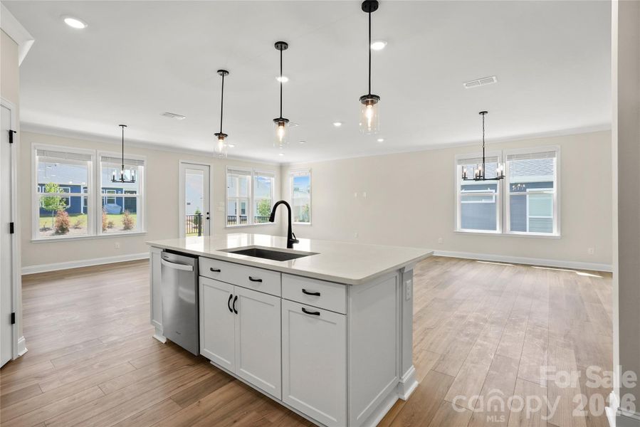 Kitchen island overlooks oversized living and dining space - an entertainer's dream!