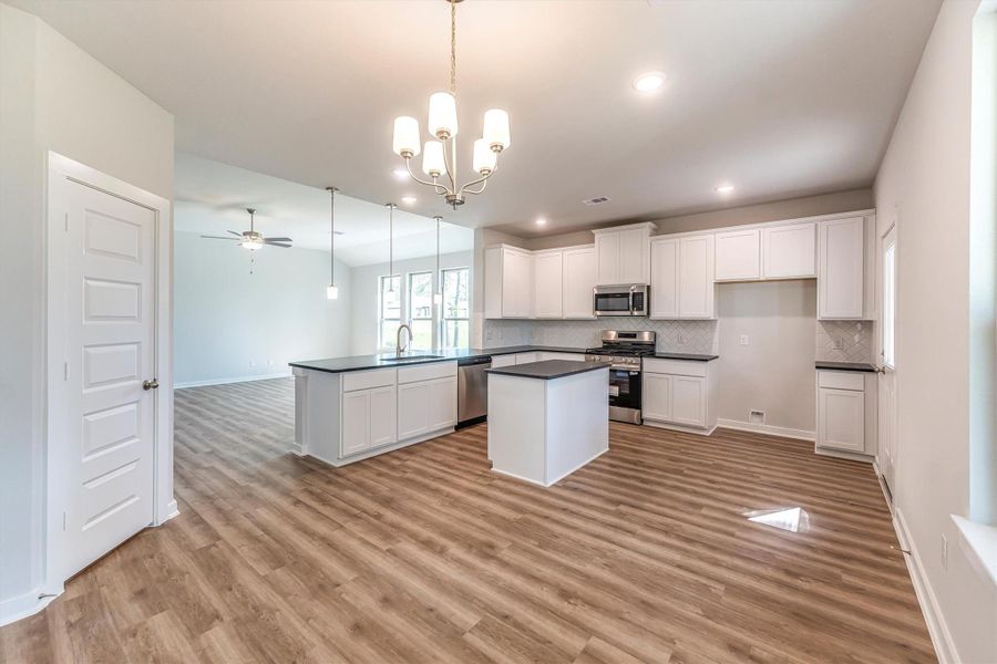 Furnished interior view inside a new home in Deer Pines, Conroe (Image 6).