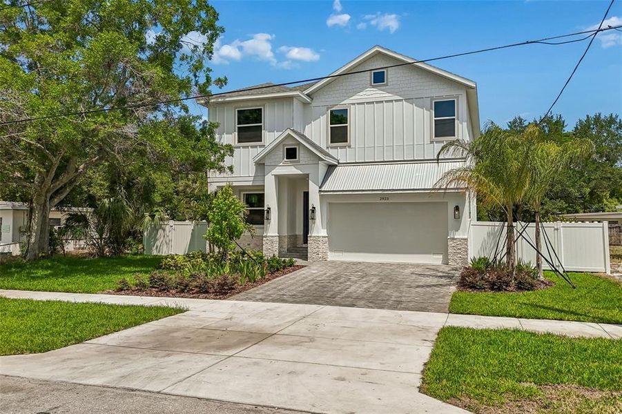 Front exterior of a new home in , Tampa, FL, highlighting curb appeal (Image 27).