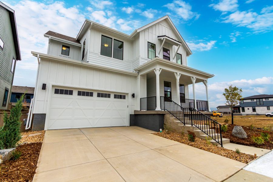 Front exterior of a new home in West Grange, Longmont, CO, highlighting curb appeal (Image 29).