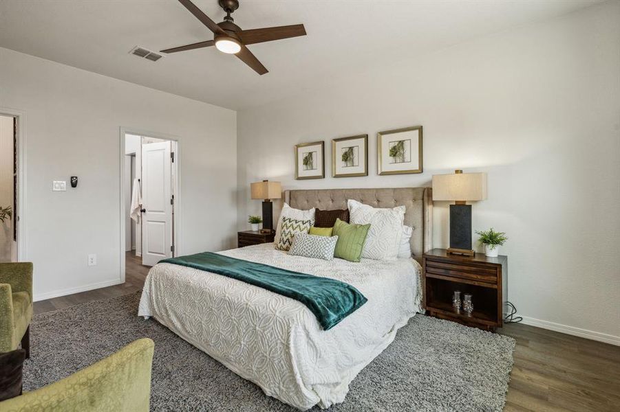 Bedroom with ceiling fan and dark wood-type flooring