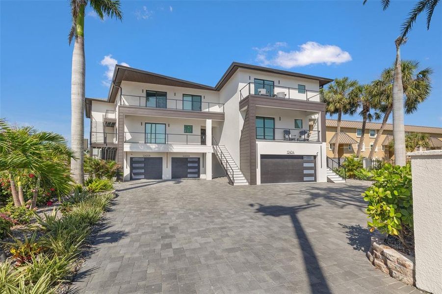 Front exterior of a new home in , Treasure Island, FL, highlighting curb appeal (Image 2). Front exterior of a new home in , Treasure Island, FL, highlighting curb appeal (Image 2).