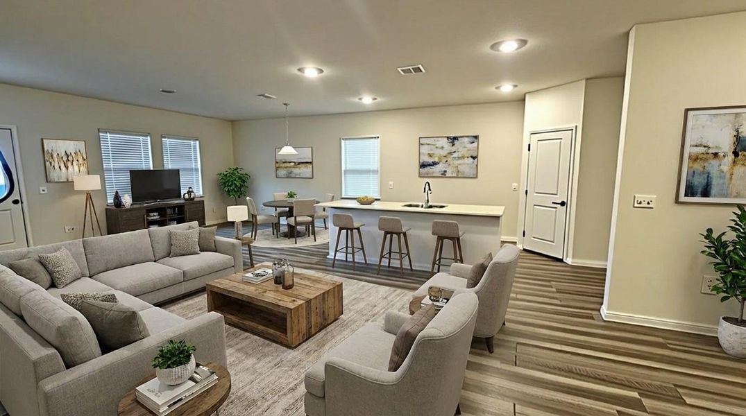 Living room featuring wood finished floors and recessed lighting