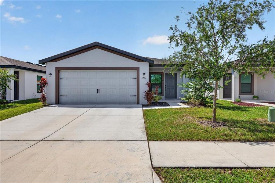 Front exterior of a new home in , Tampa, FL, highlighting curb appeal (Image 24).