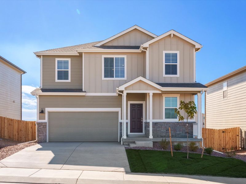 Front exterior of a new home in Lorson Ranch : The Springs Collection, Colorado Springs, CO, highlighting curb appeal (Image 1).
