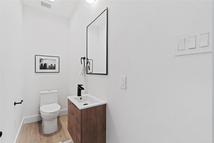 Convenient powder bath on the main floor—perfect for guests to freshen up. Convenient powder bath on the main floor—perfect for guests to freshen up.