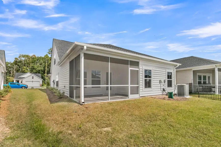 Exterior details and patio area of a home in Horizons at Summers Corner | 55+, Summerville (Image 3).