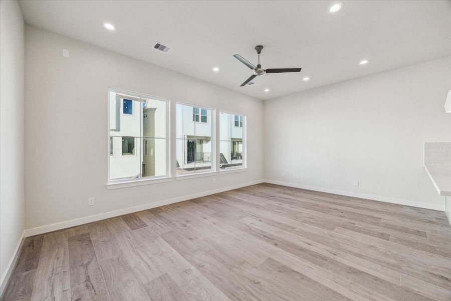 Large windows brighten the living space and create an airy, elevated feel throughout the main living level.