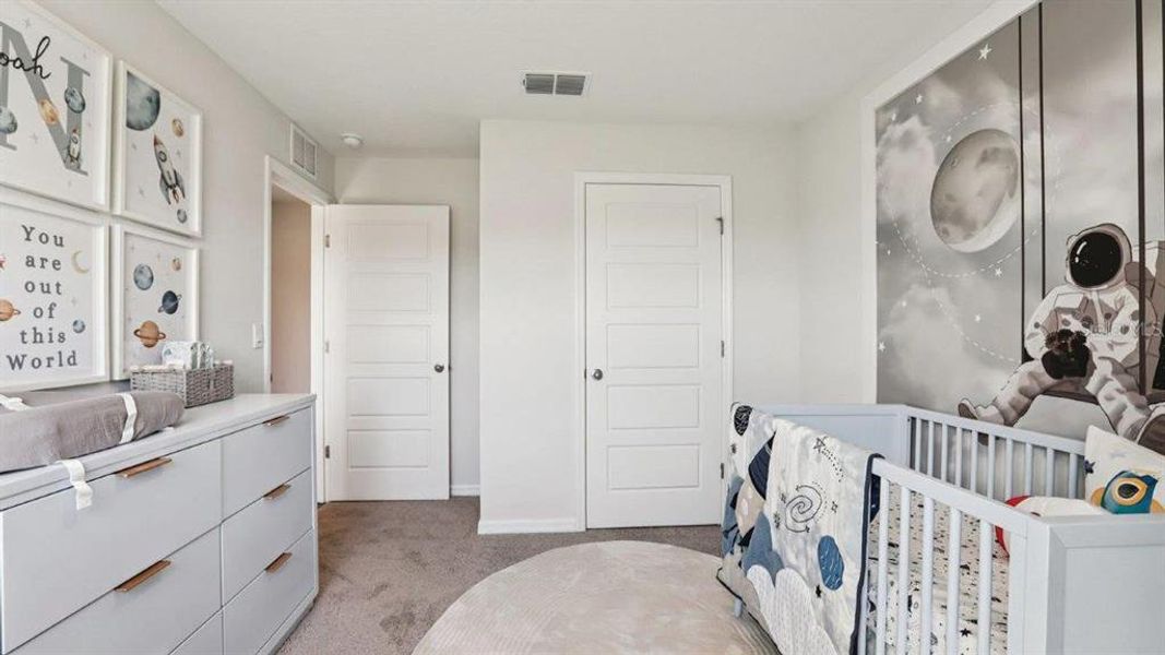 Furnished interior view inside a new home in Lake Deer Estates, Poinciana (Image 32).