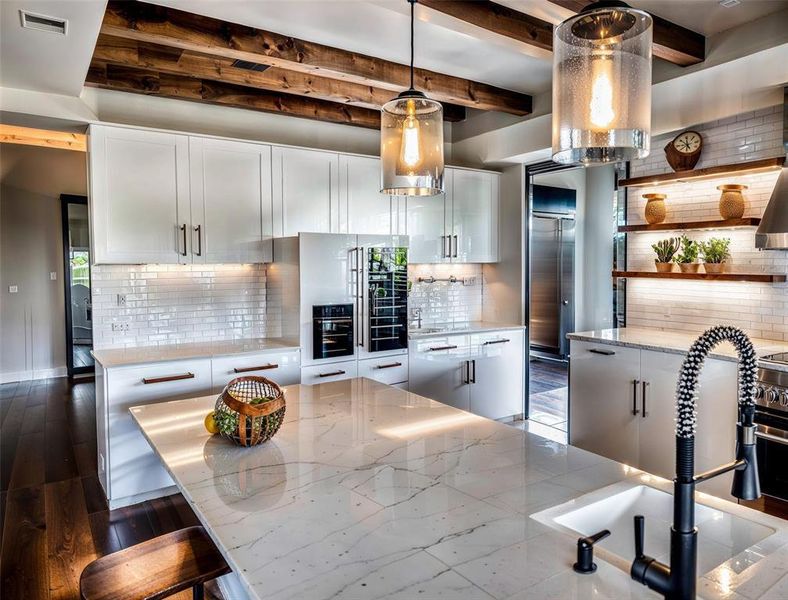 Kitchen featuring visible vents, a sink, decorative backsplash, white cabinets, and open shelves