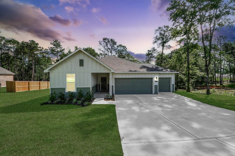 Front exterior of a new home in Oakwood Ranch, Willis, TX, highlighting curb appeal (Image 2). Front exterior of a new home in Oakwood Ranch, Willis, TX, highlighting curb appeal (Image 2).