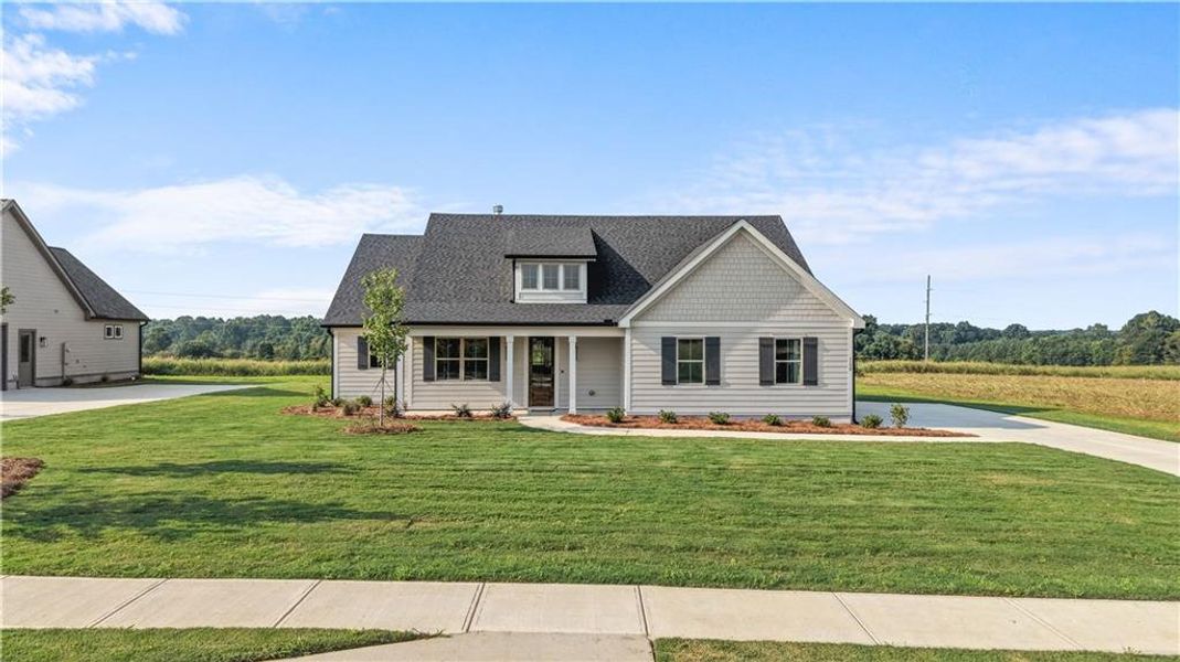 Front exterior of a new home in , Madison, GA, highlighting curb appeal (Image 28). Front exterior of a new home in , Madison, GA, highlighting curb appeal (Image 28).