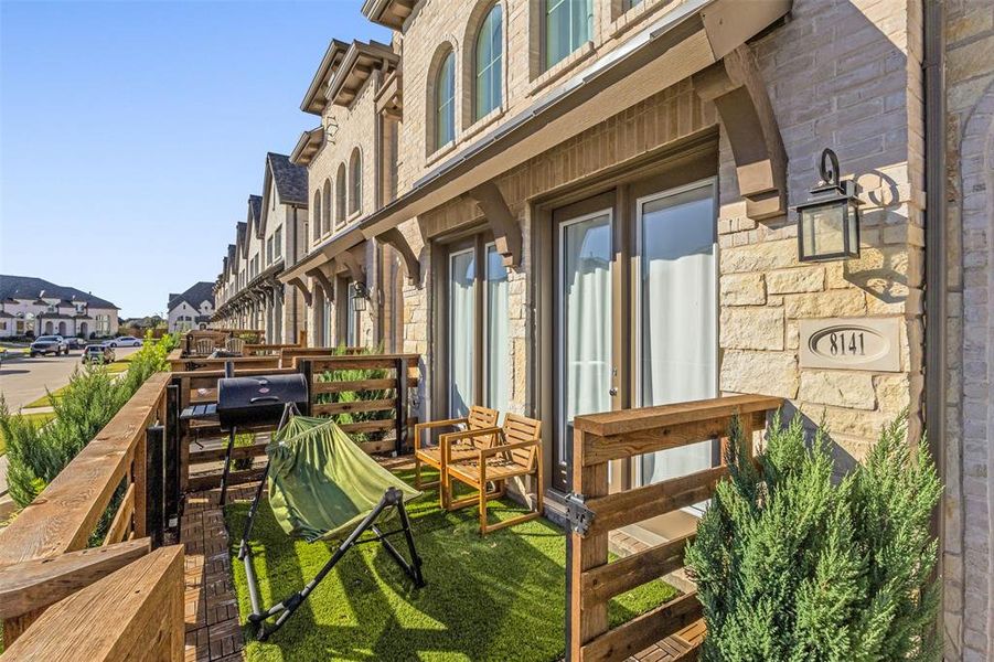 Exterior details and patio area of a home in Trinity Falls Townhomes, McKinney (Image 3).