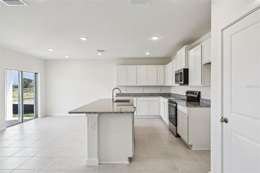 Furnished interior view inside a new home in Willowbrook North, Winter Haven (Image 5).