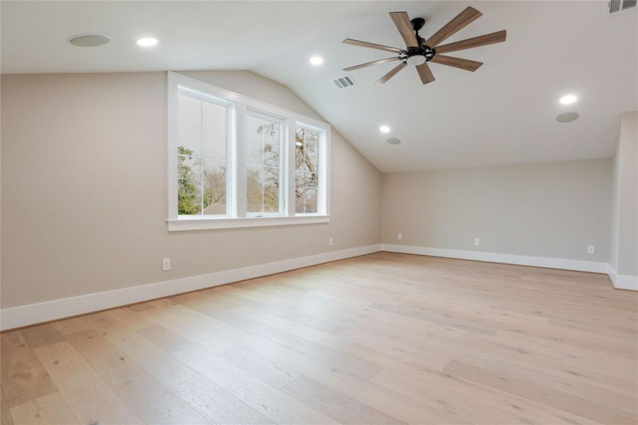 Bonus room featuring a ceiling fan, light wood finished floors, and recessed lighting