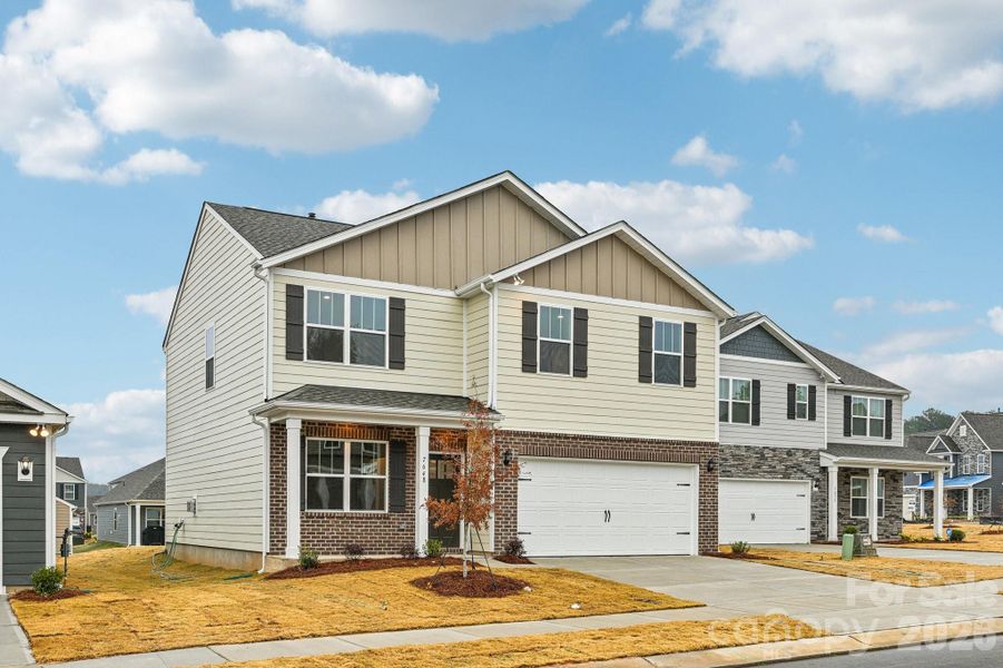 Front exterior of a new home in Laurelbrook, Sherrills Ford, NC, highlighting curb appeal (Image 1). Front exterior of a new home in Laurelbrook, Sherrills Ford, NC, highlighting curb appeal (Image 1).