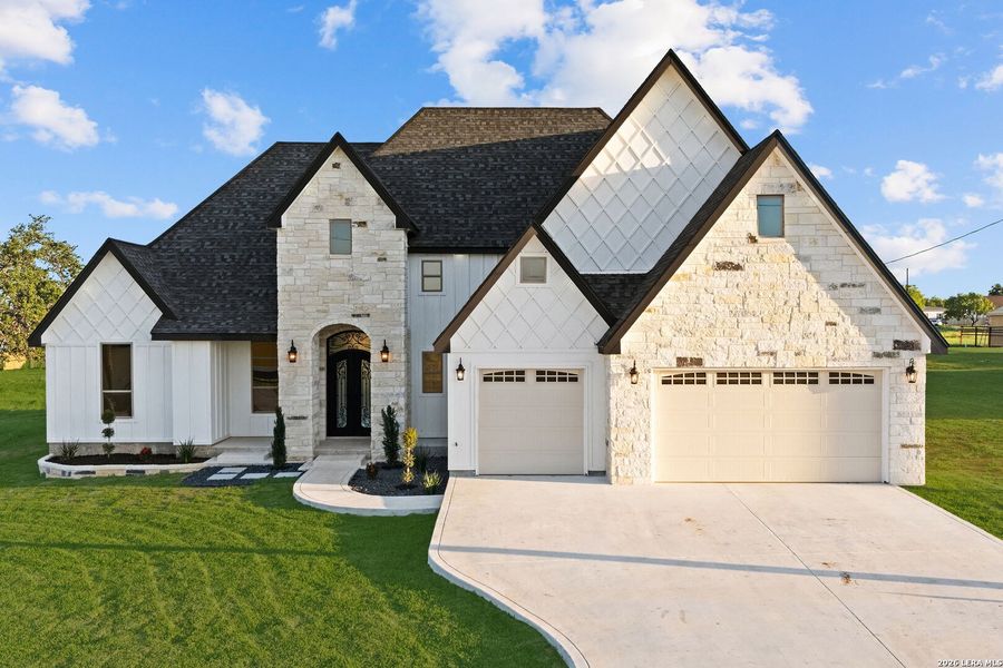Front exterior of a new home in , Atascosa, TX, highlighting curb appeal (Image 26).