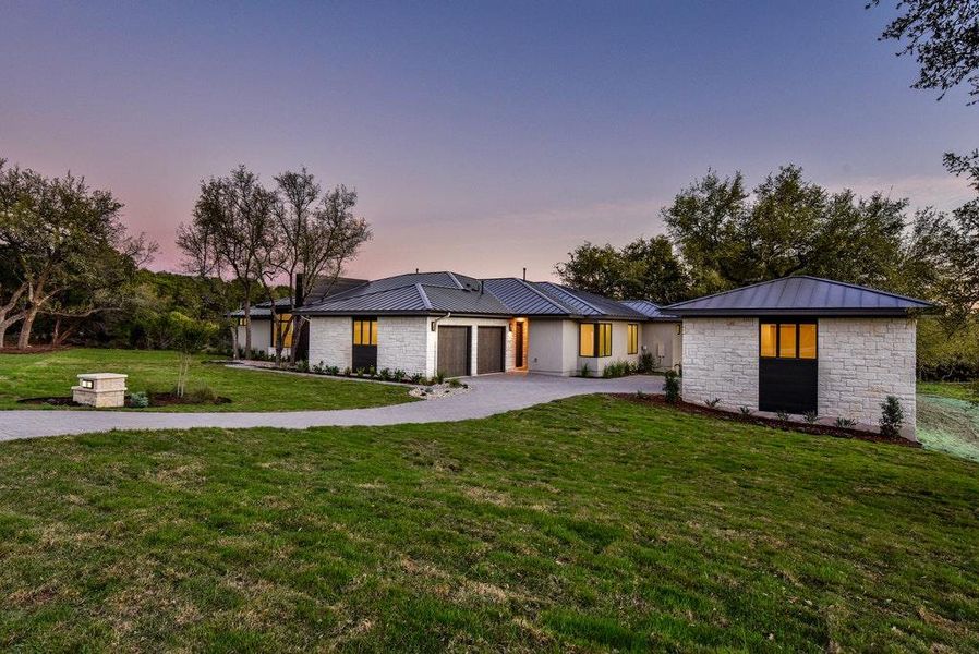 Front exterior of a new home in , Dripping Springs, TX, highlighting curb appeal (Image 23). Front exterior of a new home in , Dripping Springs, TX, highlighting curb appeal (Image 23).