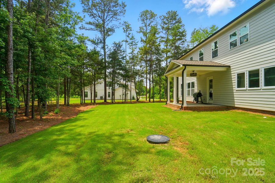 Front exterior of a new home in Fairview Forest, Indian Trail, NC, highlighting curb appeal (Image 20). Front exterior of a new home in Fairview Forest, Indian Trail, NC, highlighting curb appeal (Image 20).