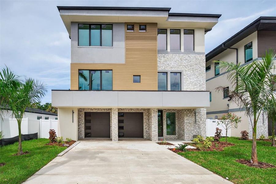 Front exterior of a new home in , St. Petersburg, FL, highlighting curb appeal (Image 23).