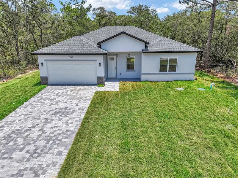 Front exterior of a new home in , Citrus Springs, FL, highlighting curb appeal (Image 19).