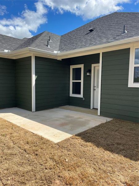 Doorway to property featuring a patio