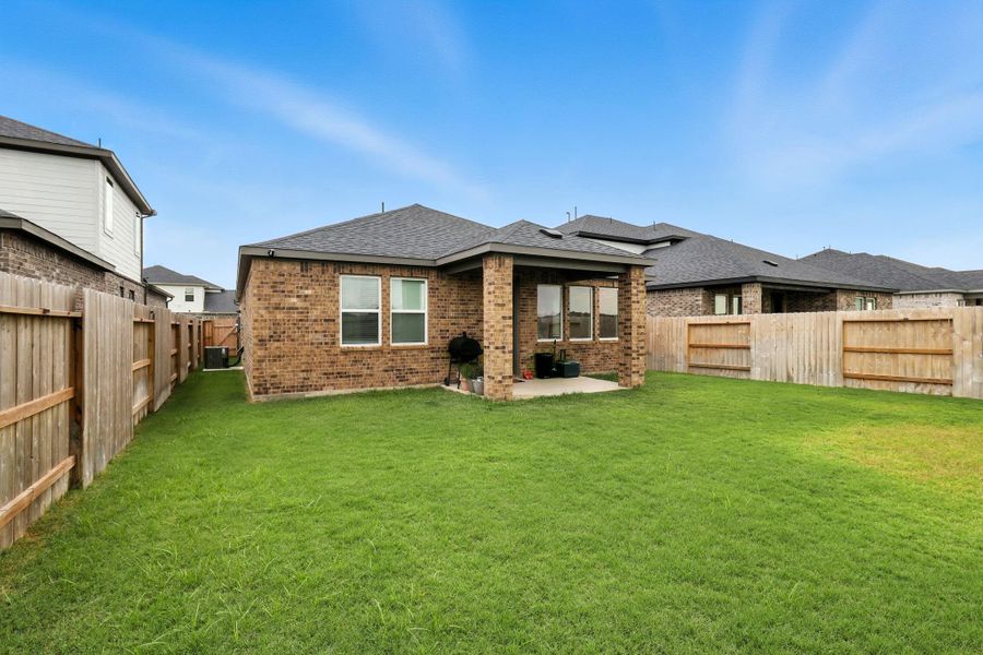Front exterior of a new home in Bridge Creek 45s and 50s, Cypress, TX, highlighting curb appeal (Image 22). Front exterior of a new home in Bridge Creek 45s and 50s, Cypress, TX, highlighting curb appeal (Image 22).
