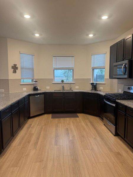 Furnished interior view inside a new home in Sunterra, Katy (Image 12).