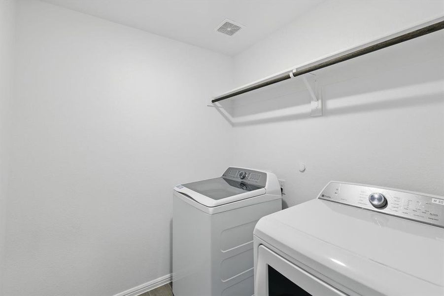 Washroom with washer and clothes dryer Washroom with washer and clothes dryer