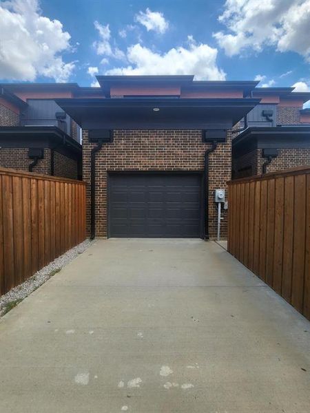 View of side of home featuring a garage