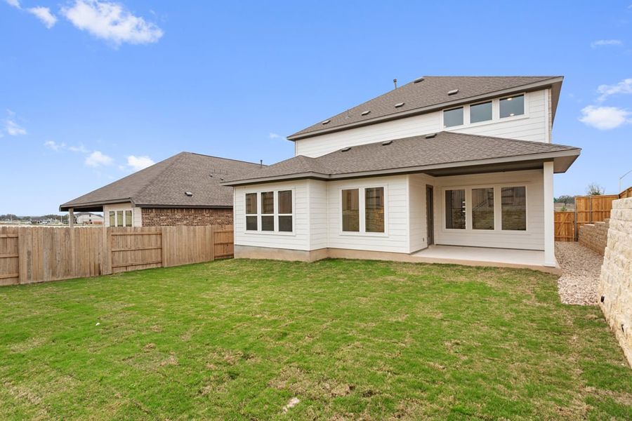 Exterior details and patio area of a home in Park Collection at Lariat, Liberty Hill (Image 29).