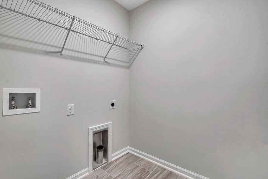 Representative unfurnished interior of a home built from the The Hatteras by Smith Family Homes in Ramsey Landing, Rincon (Image 27).
