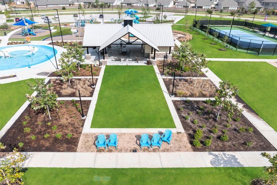 A peaceful sitting area overlooking the open lawn — ideal for picnics, reading, or relaxing afternoons.