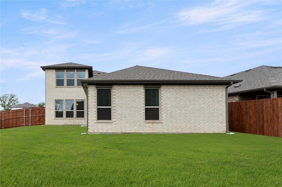 Exterior details and patio area of a home in Keeneland, Aubrey (Image 2).