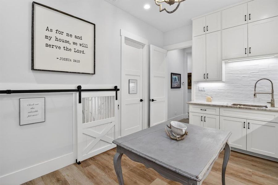 This is a laundry/craft room like none other. You will not believe the size and the amount of storage!