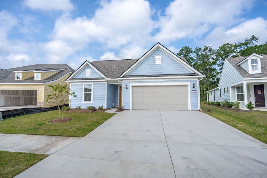 Front exterior of a new home in Del Webb Charleston at Nexton, Summerville, SC, highlighting curb appeal (Image 24). Front exterior of a new home in Del Webb Charleston at Nexton, Summerville, SC, highlighting curb appeal (Image 24).