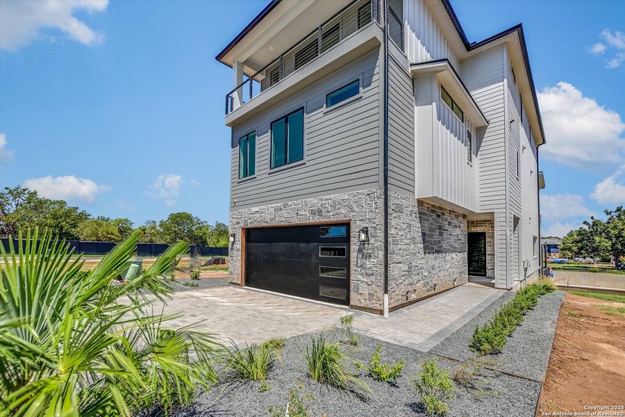 Front exterior of a new home in , Kingsland, TX, highlighting curb appeal (Image 26).
