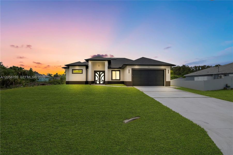 Front exterior of a new home in , Lehigh Acres, FL, highlighting curb appeal (Image 23).