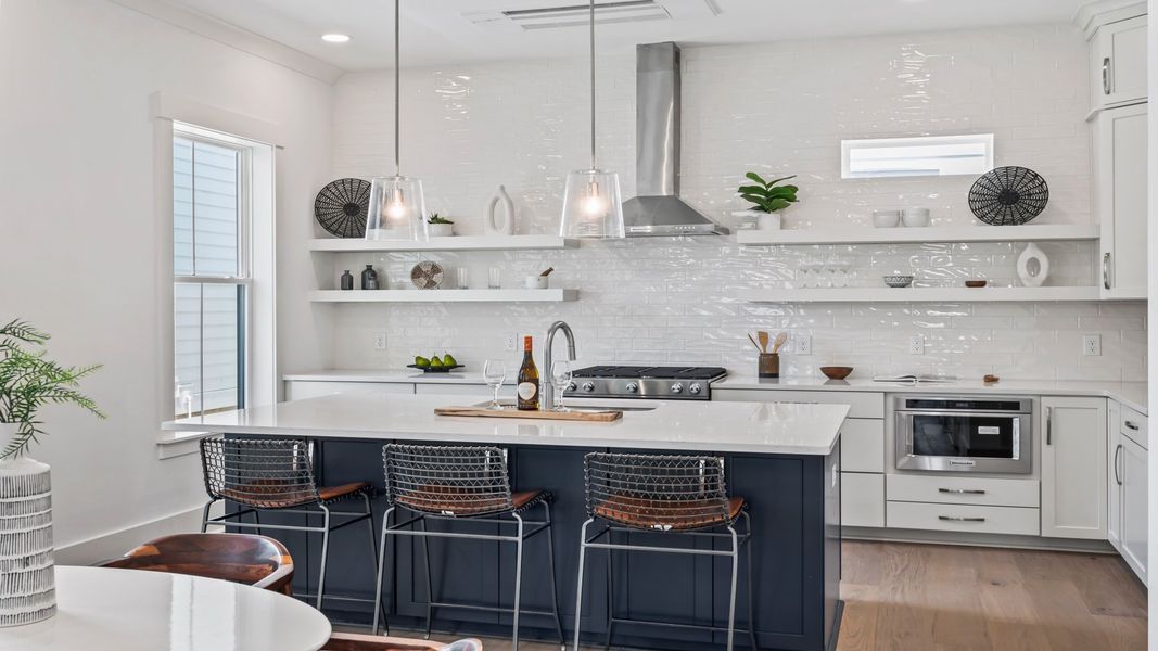 The Sullivan model home features a chef-inspired kitchen with a large island, designer finishes, and open-concept flow.
