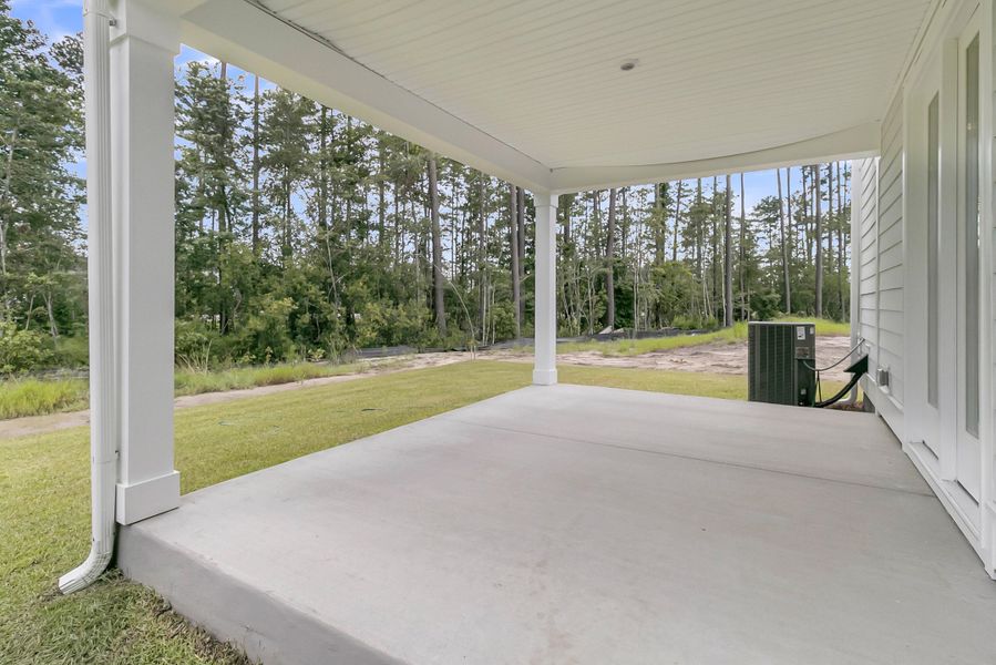 Exterior details and patio area of a home in Tidewater at Lakes of Cane Bay, Summerville (Image 28).