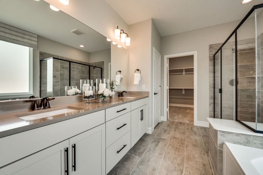 Spacious owner's bath with tile-flooring and doubl