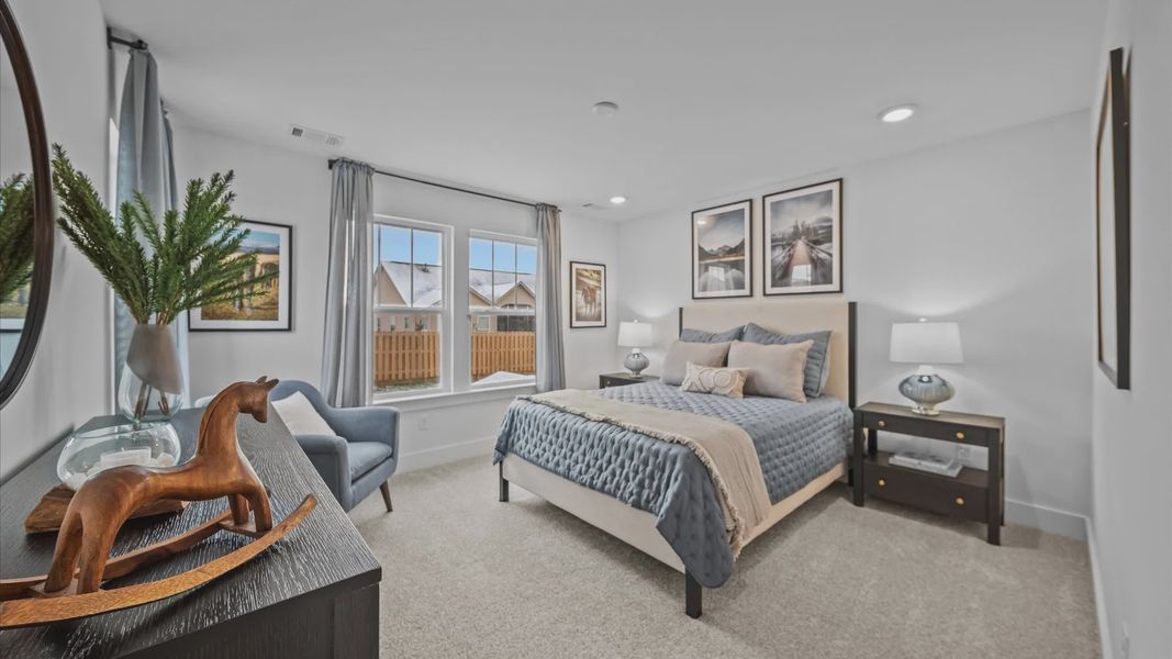 Highly functional bedroom with walk-in closet and tasteful carpet for a restful retreat Highly functional bedroom with walk-in closet and tasteful carpet for a restful retreat