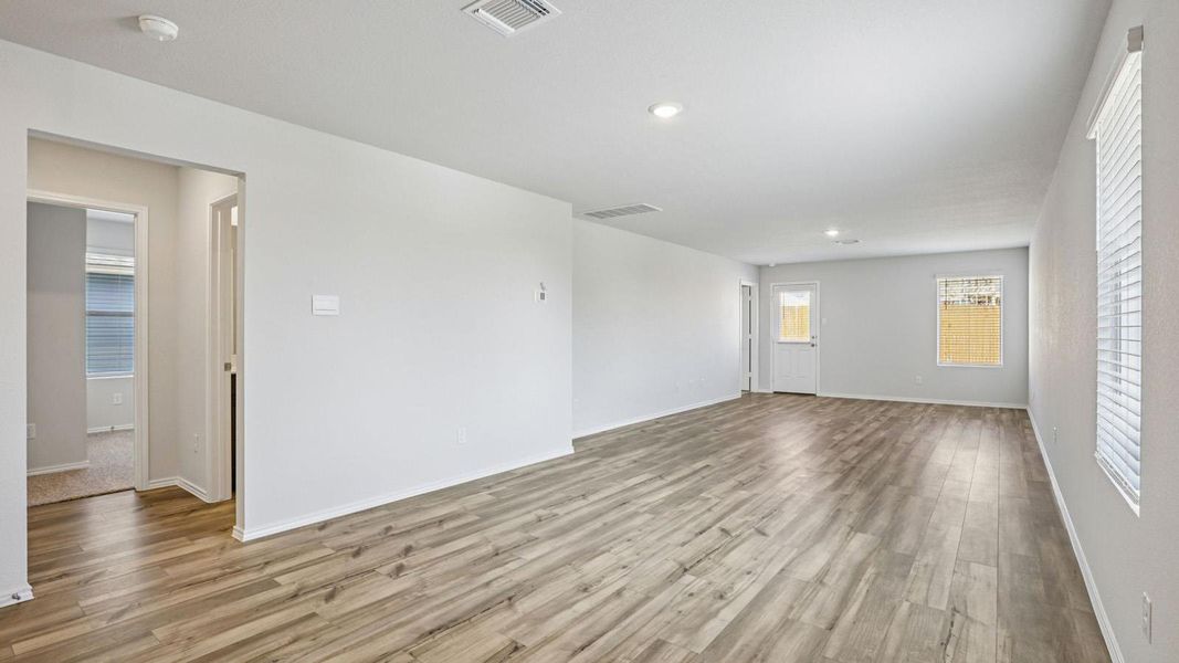 Spare room featuring light wood finished floors and recessed lighting